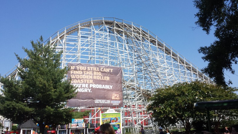 Snickers ad on the side of a wooden roller coaster