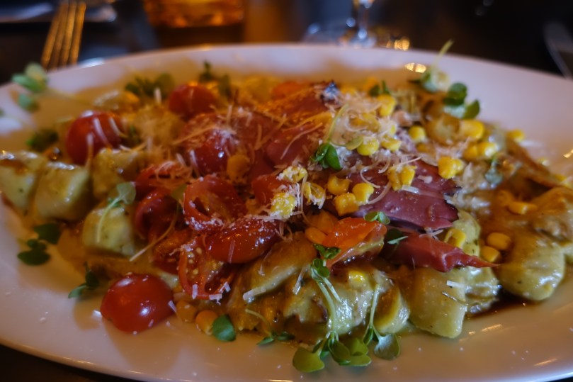 Handcrafted gnocchi with confit duck ragu, smoked duck breast, corn & leek purée, pomegranate drizzle 