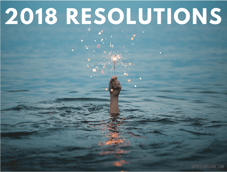 2018 Resolutions: photo featuring a hand holding a sparkler above water